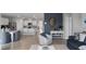 Open-concept living space connects the kitchen to a cozy and stylish seating area at 4411 Blackwell Ave, Lake Wales, FL 33859
