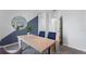 Bright office features a light wood desk, seating for three, and modern decor, creating a productive workspace at 4411 Blackwell Ave, Lake Wales, FL 33859