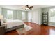 Spacious bedroom with beautiful hardwood floors, neutral paint, two large closets and large windows at 447 Kehoe Blvd, Orlando, FL 32825