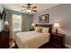 Cozy bedroom featuring a comfortable bed, classic furniture, and soft lighting from bedside lamps at 447 Kehoe Blvd, Orlando, FL 32825
