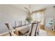 Elegant dining area featuring a tufted chairs, modern chandelier, and ample natural light at 447 Kehoe Blvd, Orlando, FL 32825