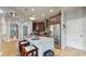 Open-concept kitchen with granite island, stainless appliances, and ample cabinet space, ideal for entertaining at 447 Kehoe Blvd, Orlando, FL 32825