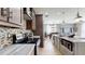 Modern kitchen with granite countertops, stainless steel appliances, and an open layout leading to the dining area at 447 Kehoe Blvd, Orlando, FL 32825
