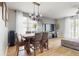 Inviting living space featuring wood-look flooring, comfortable seating, and an open layout to the dining area at 447 Kehoe Blvd, Orlando, FL 32825