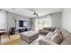 Comfortable living room with a large sectional couch, TV and ceiling fan at 447 Kehoe Blvd, Orlando, FL 32825