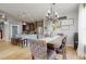 Spacious living area featuring a kitchen island with bar seating, perfect for gatherings at 447 Kehoe Blvd, Orlando, FL 32825