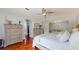 This bedroom features a large bed, hardwood floors and plenty of natural light from the windows at 447 Kehoe Blvd, Orlando, FL 32825