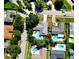 Aerial view of the home showing a swimming pool and neighborhood at 5096 The Oaks Cir, Orlando, FL 32809