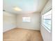 Spacious bedroom with two windows, offering ample natural light and carpeted floors at 5096 The Oaks Cir, Orlando, FL 32809