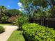 Well-maintained landscaping showcasing lush greenery and vibrant flowers enhances the curb appeal at 5096 The Oaks Cir, Orlando, FL 32809
