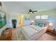 Virtually staged main bedroom with modern décor, a large bed, and a bright and airy atmosphere at 5096 The Oaks Cir, Orlando, FL 32809