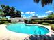 Large pool with crystal clear water and inviting landscaping, perfect for warm days and backyard fun at 5096 The Oaks Cir, Orlando, FL 32809
