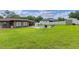 Expansive backyard with in-ground pool, mature trees, and full privacy fence at 51 Seminole Dr, Debary, FL 32713