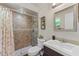 Tiled bathroom featuring a shower with a curtain, a toilet, and a vanity with a sink at 51 Seminole Dr, Debary, FL 32713