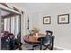 Cozy dining area featuring a wooden table set, comfortable seating, and sliding glass doors at 51 Seminole Dr, Debary, FL 32713