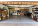 Open garage with lots of storage, laundry area, and a ceiling fan at 51 Seminole Dr, Debary, FL 32713