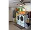 Bright garage with large capacity washer and dryer, cabinets, and plenty of storage at 51 Seminole Dr, Debary, FL 32713