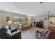 Inviting living room with comfortable seating, a large window, and modern decor creating a welcoming space at 51 Seminole Dr, Debary, FL 32713