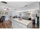Open concept living area featuring island seating with views of the living room and dining area at 51 Seminole Dr, Debary, FL 32713