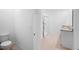 Bathroom features a double vanity with granite countertop, shower, and tile flooring at 522 Anne St, Deland, FL 32724