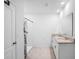 Bathroom featuring double sink vanity with granite countertop and a walk-in shower at 522 Anne St, Deland, FL 32724