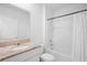 Clean bathroom featuring a granite vanity, shower/tub, and white toilet at 522 Anne St, Deland, FL 32724