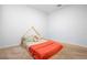 A cozy carpeted bedroom featuring a bed and natural light at 522 Anne St, Deland, FL 32724