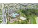 Aerial view of the community pool featuring a sand volleyball court and playground with ample parking at 522 Anne St, Deland, FL 32724