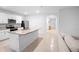 Open-concept kitchen with a large island and white cabinetry at 522 Anne St, Deland, FL 32724