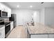 Spacious kitchen with a large island and stainless steel appliances at 522 Anne St, Deland, FL 32724
