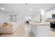 Open-concept kitchen with granite countertops and stainless steel appliances at 522 Anne St, Deland, FL 32724