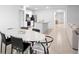 Open-concept living space with a kitchen, dining area, and entryway, perfect for entertaining and everyday living at 522 Anne St, Deland, FL 32724