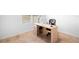Modern office setup featuring a sleek desk, comfortable chair, and lots of light at 522 Anne St, Deland, FL 32724