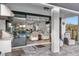 Covered patio featuring outdoor seating and a view of the pool and interior living space at 7454 Gathering Dr, Reunion, FL 34747