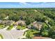 Aerial shot showcases home in lush neighborhood; nearby roads and similar homes can be seen at 7819 Canyon Lake Cir, Orlando, FL 32835