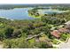 Aerial view of a waterfront community with scenic views and lush landscaping, blending natural beauty at 7819 Canyon Lake Cir, Orlando, FL 32835