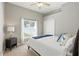 Bedroom with white comforter, dark wood furniture, neutral walls and carpet and a window with backyard view at 7819 Canyon Lake Cir, Orlando, FL 32835