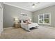 A spacious bedroom with a ceiling fan and plenty of natural light at 7819 Canyon Lake Cir, Orlando, FL 32835