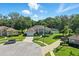 Charming home with well-manicured lawn, mature trees, and circular driveway enhancing curb appeal at 7819 Canyon Lake Cir, Orlando, FL 32835