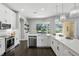 Bright modern kitchen with stainless steel appliances and a view of the backyard pool at 7819 Canyon Lake Cir, Orlando, FL 32835