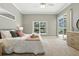 A modern bedroom with sliding glass doors leading to the pool area at 7819 Canyon Lake Cir, Orlando, FL 32835