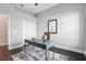 Office space with hardwood floors, a modern desk, neutral walls, and double door closet at 7819 Canyon Lake Cir, Orlando, FL 32835