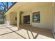 Covered patio with a ceiling fan, offering views of the interior at 7819 Canyon Lake Cir, Orlando, FL 32835