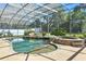 A serene pool area features a rock waterfall and jacuzzi at 7819 Canyon Lake Cir, Orlando, FL 32835