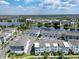 Gorgeous aerial view of lakefront townhomes in a Gathering-friendly neighborhood, showcasing green space and water views at 8484 Sperry St, Orlando, FL 32827