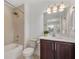 Modern bathroom featuring tiled shower and vanity sink with cabinets at 8484 Sperry St, Orlando, FL 32827