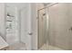Modern bathroom with tiled shower and glass door at 8484 Sperry St, Orlando, FL 32827