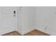 Bright entryway featuring a modern door, neutral walls and light hardwood flooring at 8484 Sperry St, Orlando, FL 32827