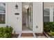Inviting entryway featuring a light-colored door, modern lighting and neutral wall colors at 8484 Sperry St, Orlando, FL 32827