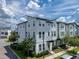 Charming townhome featuring a modern design, multiple windows, and well-manicured landscaping at 8484 Sperry St, Orlando, FL 32827